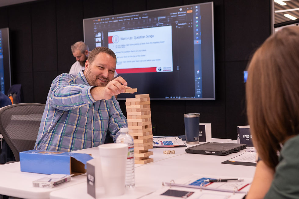 Colleagues enjoying employee benefits and perks by playing Jenga