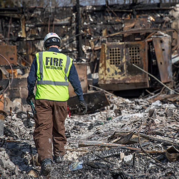 Fire investigator performing forensic structural engineering services.