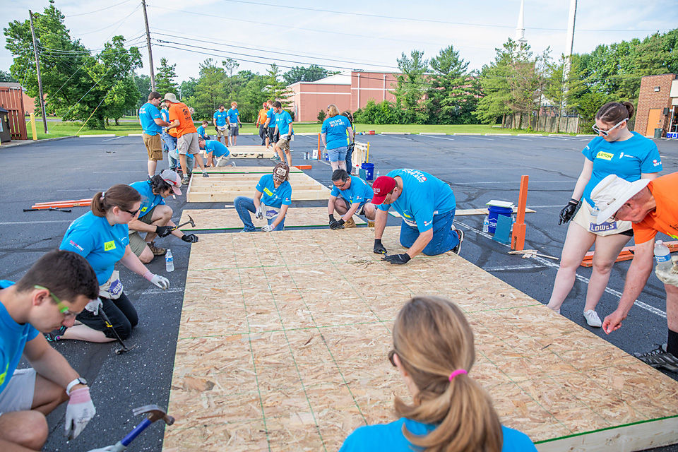 Team volunteering, part of employee benefits and perks.