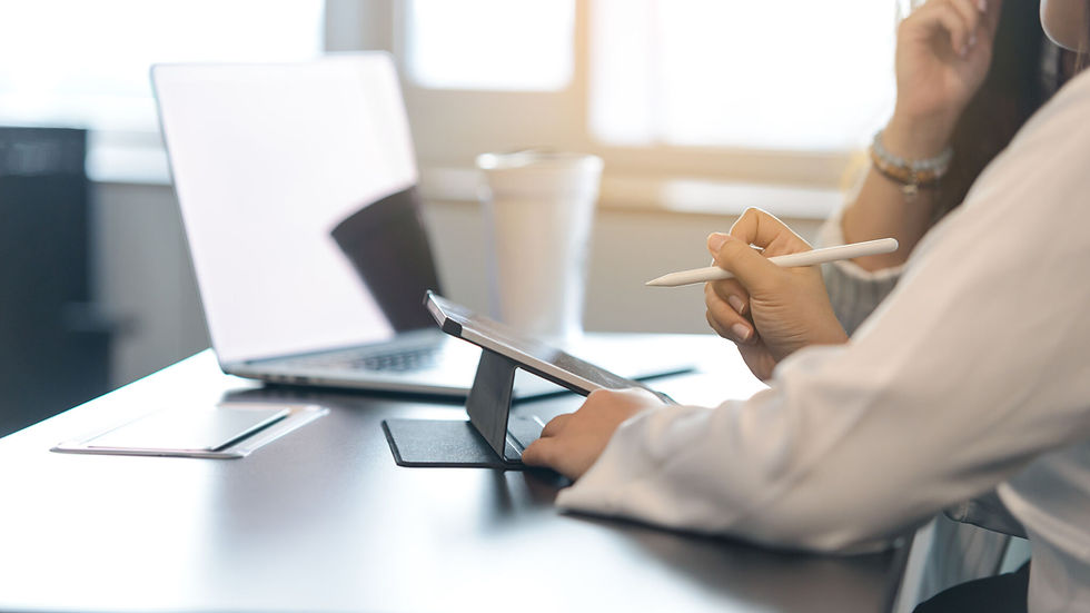 Professional using a tablet for IT consulting services.