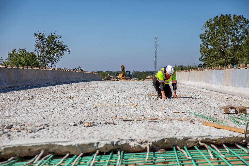 Worker on a bridge project by American Structurepoint.