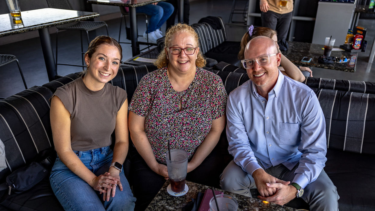 Three colleagues enjoying employee benefits and perks.