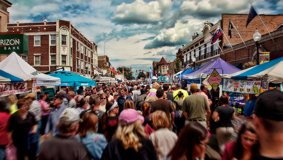 Crowded street festival for planning and economic development services.