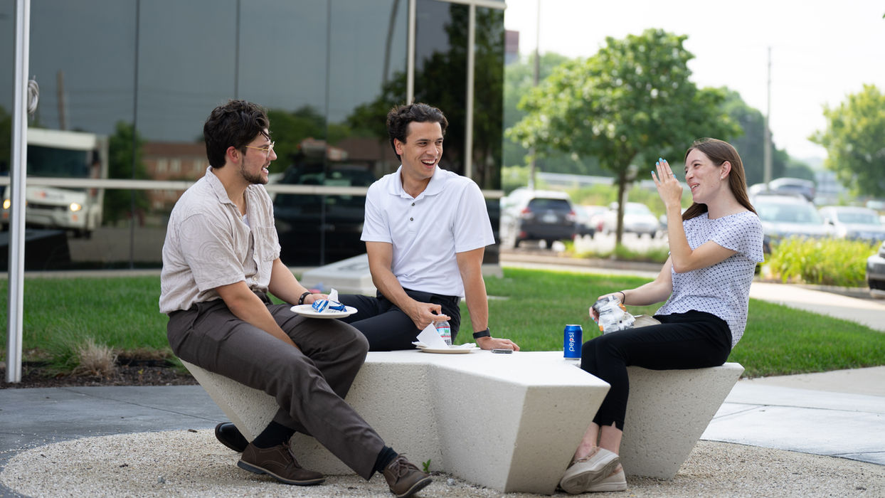 Employees enjoying outdoor employee benefits and perks.