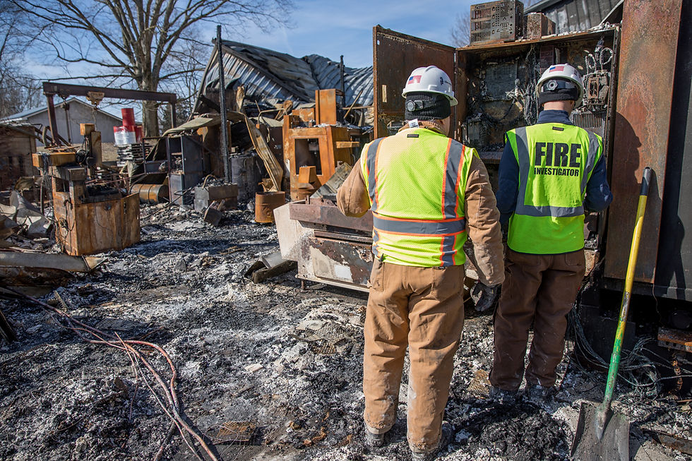 American Structurepoint team inspecting fire damage site.