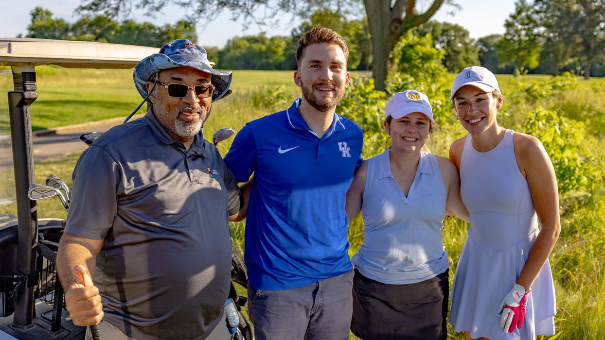 Employees enjoying golf as part of employee benefits and perks