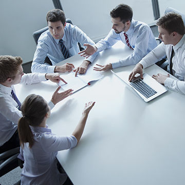 Professionals discussing forensic structural engineering services