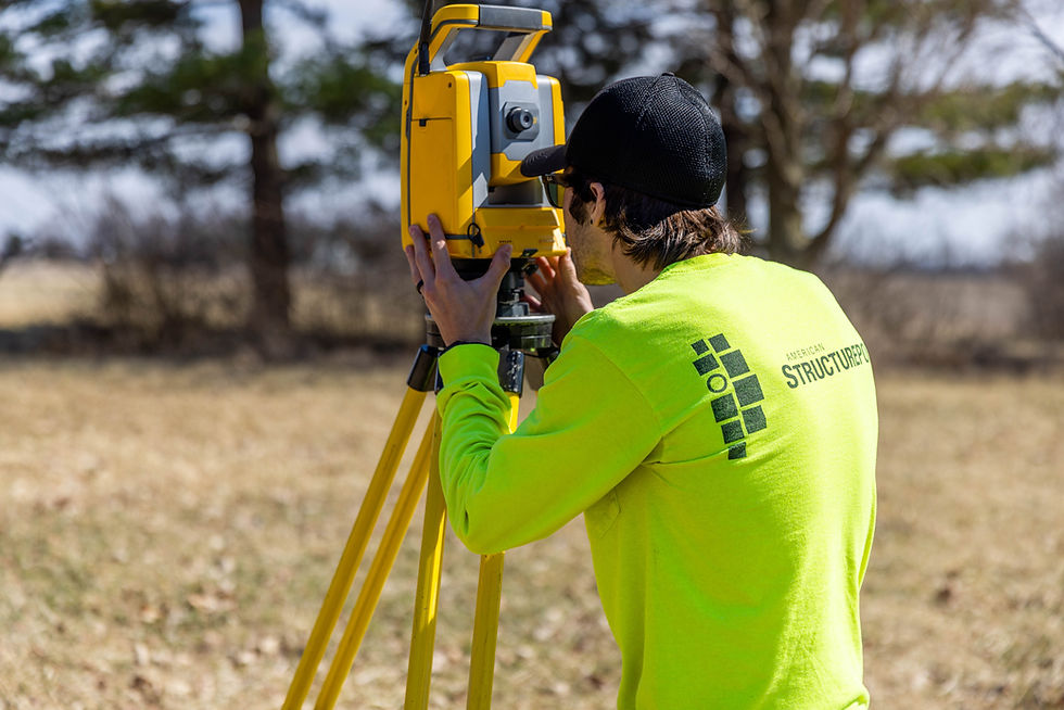 Surveyor from American Structurepoint using a total station.