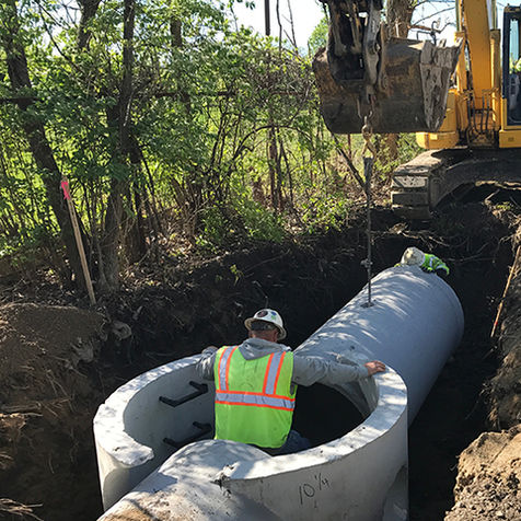 American Structurepoint services installing utility pipes.
